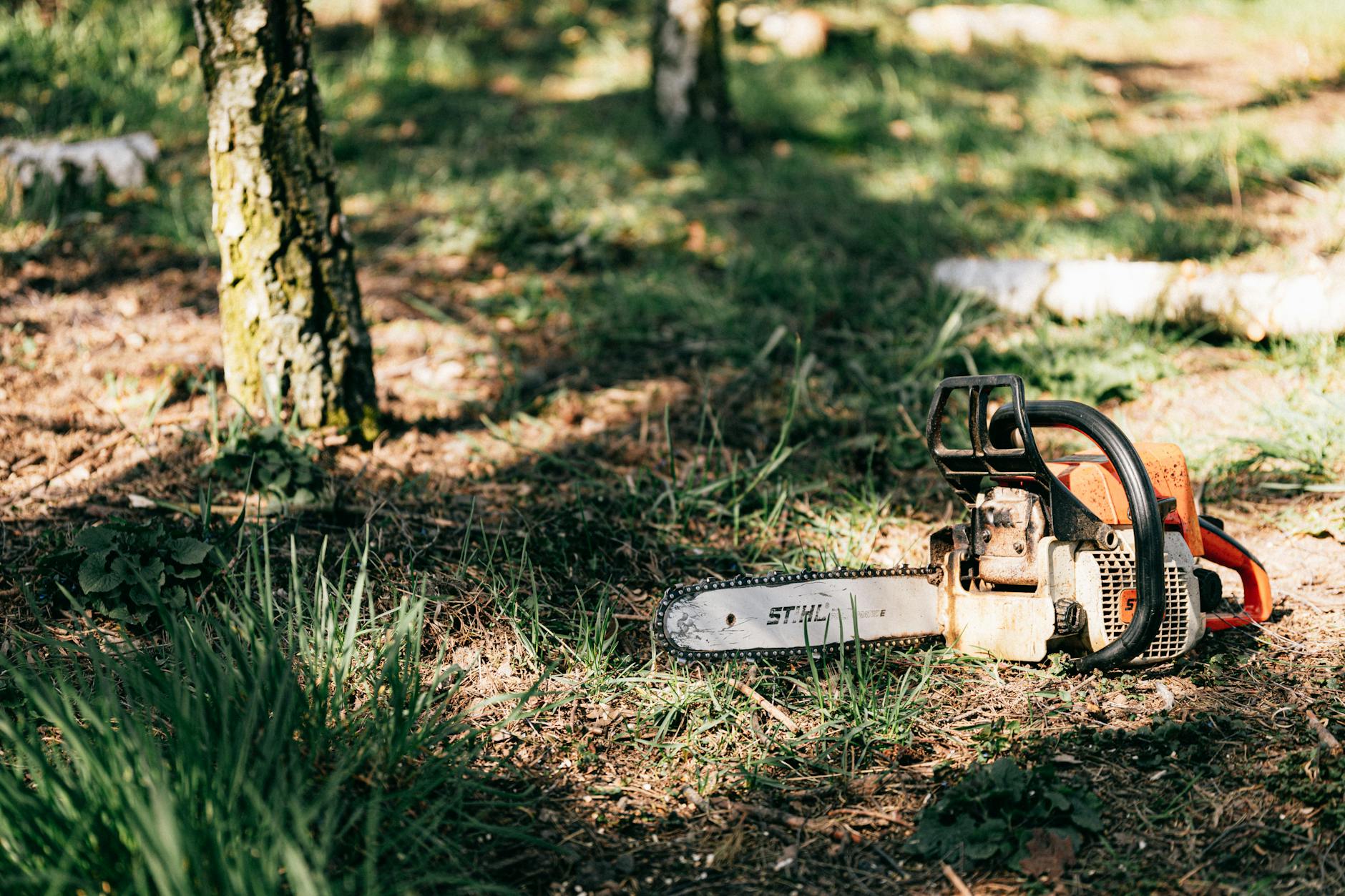 photo of chainsaw on ground